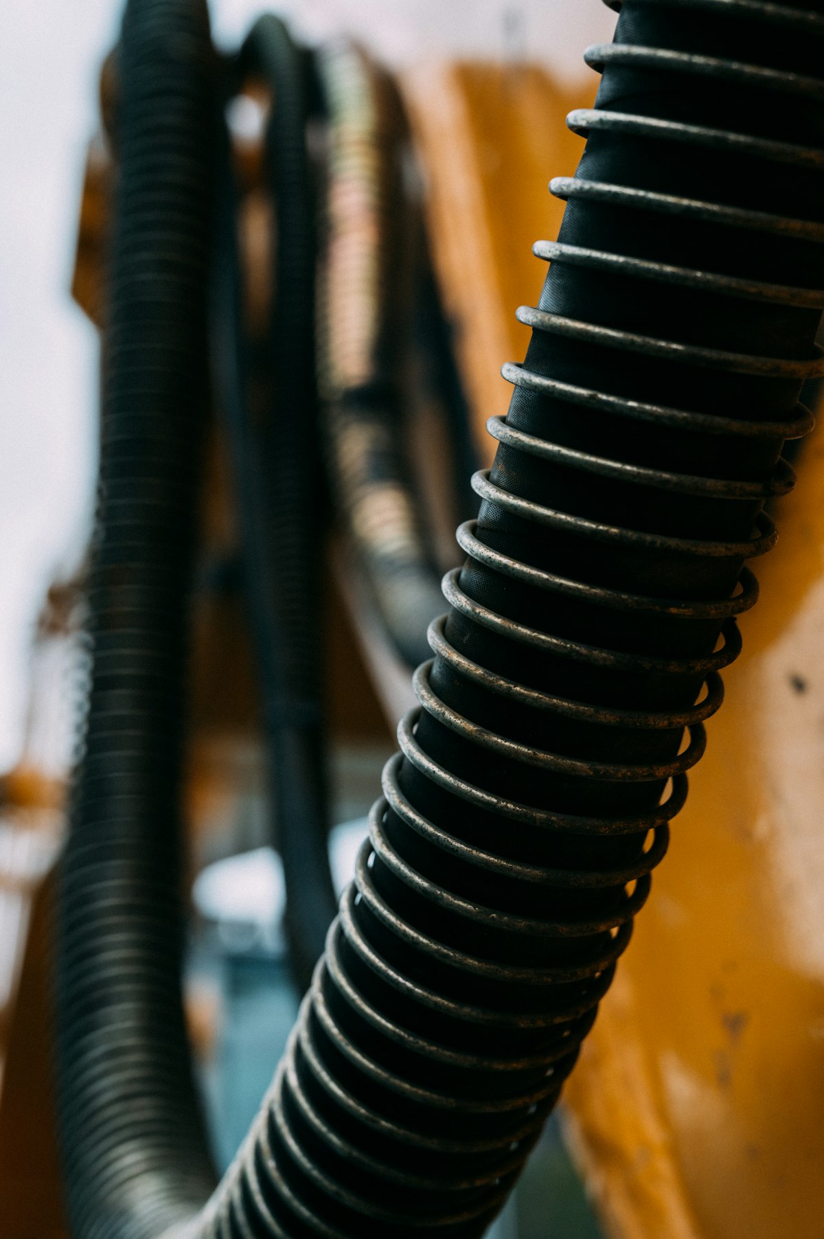 Hydraulic hoses routed on heavy equipment