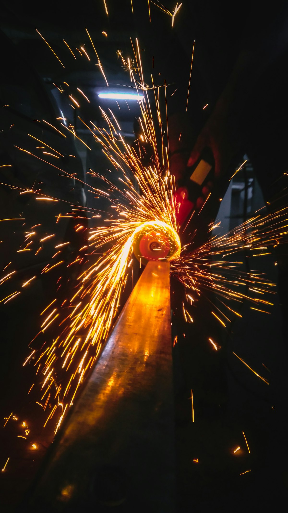 Sparks flying during metal grinding and welding
